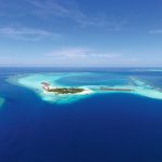 Constance Moofushi Maldives - Vue aérienne de l'île et du lagon