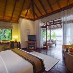 Baros Maldives - La chambre et la plage d'une Deluxe Villa