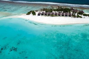 Atmosphere Kanifushi Maldives - Une vue aérienne des Sunset Pool Villas