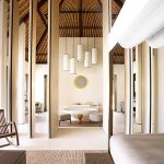 Cheval Blanc Randheli - La chambre et la salle de bains d'une Garden Water Villa